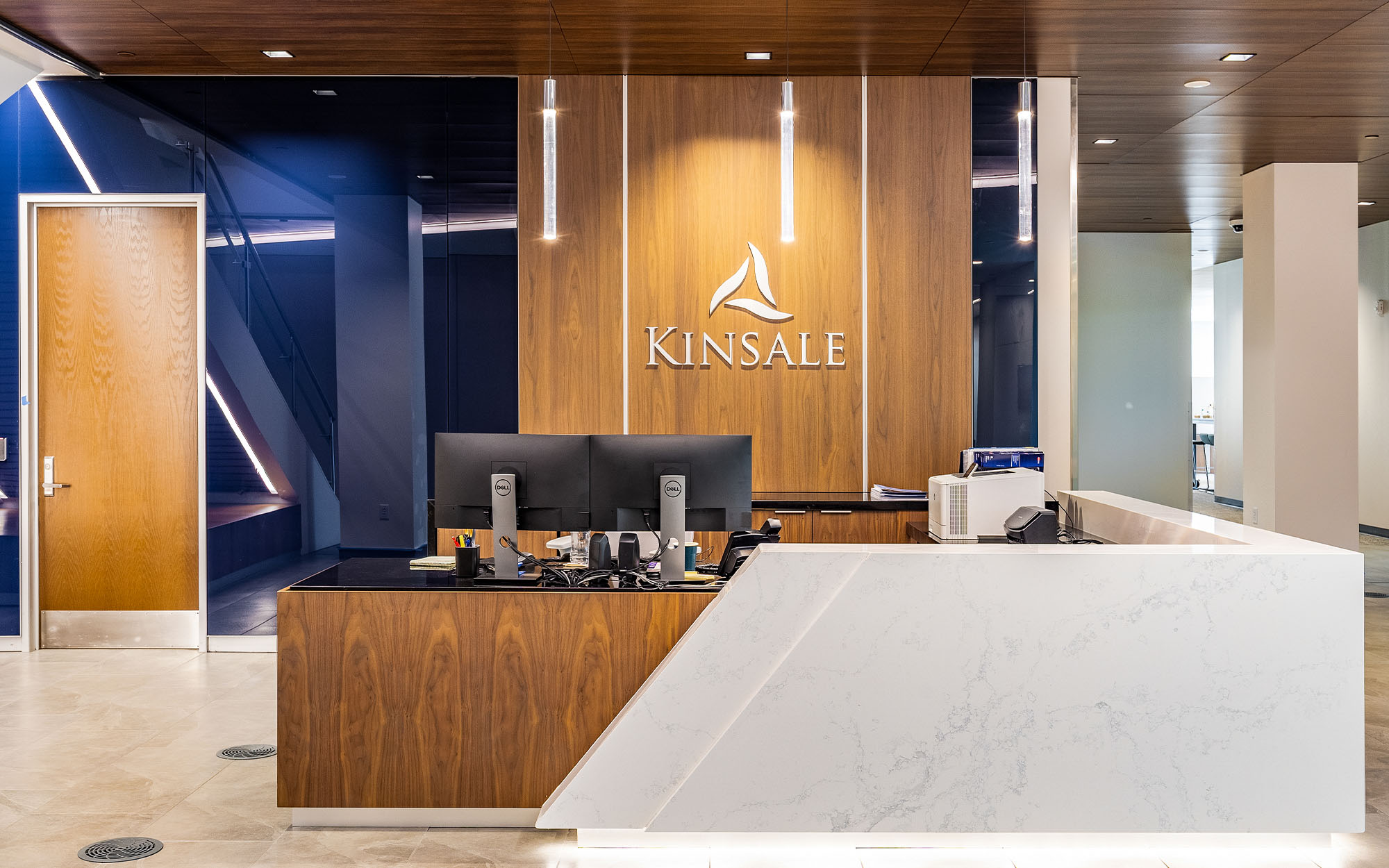 blue backpainted glass by the reception desk at kinsale corporate building in richmond va-closeup